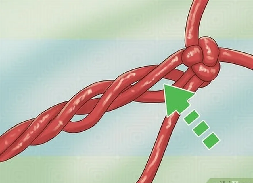 шаг 1 отделите пряди веревки под узлом.