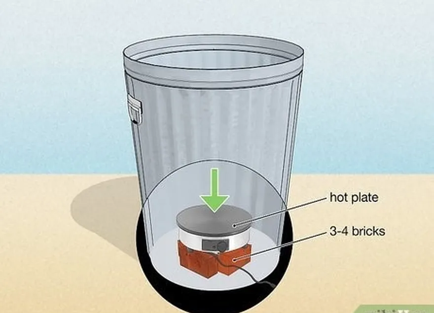 шаг 2 поместите горячую пластину на дно мусорного ведра.