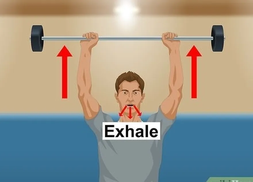 шаг 6 выдохните, когда будете толкать штангу прямо над головой.