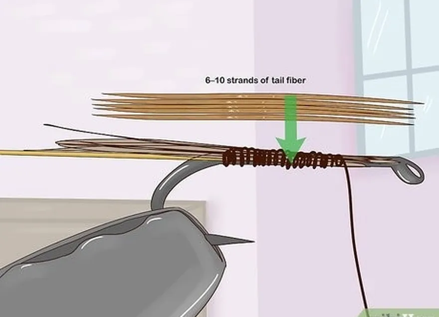 шаг 3 привяжите 6-10 нитей хвостового волокна к стержню крючка.